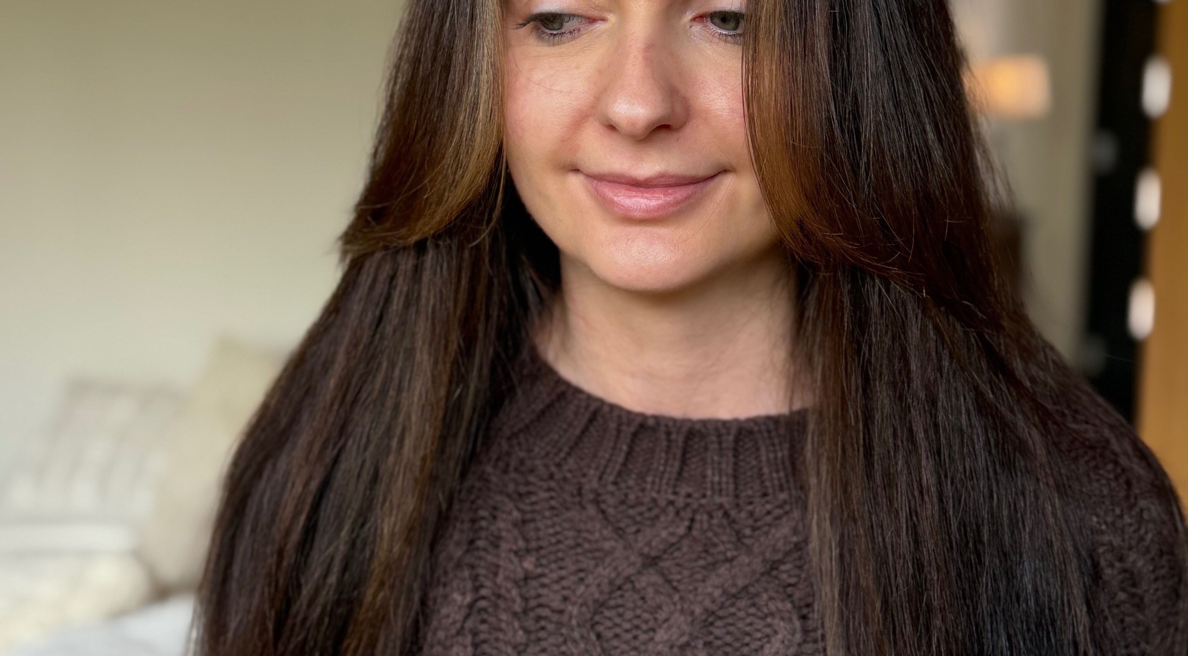 Woman with sleek brown hair styled at Hair by Jasmine Eden, Henley-on-thames, England, GB.