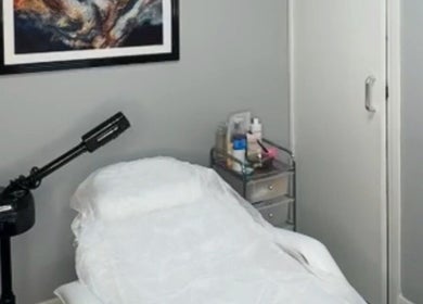 Tranquil treatment room at Bodmerised in Romford, England, GB featuring comfortable massage table.
