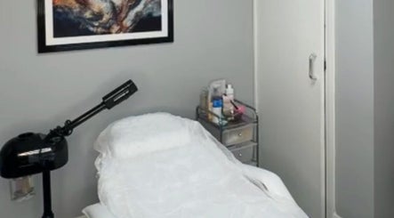 Tranquil treatment room at Bodmerised in Romford, England, GB featuring comfortable massage table.