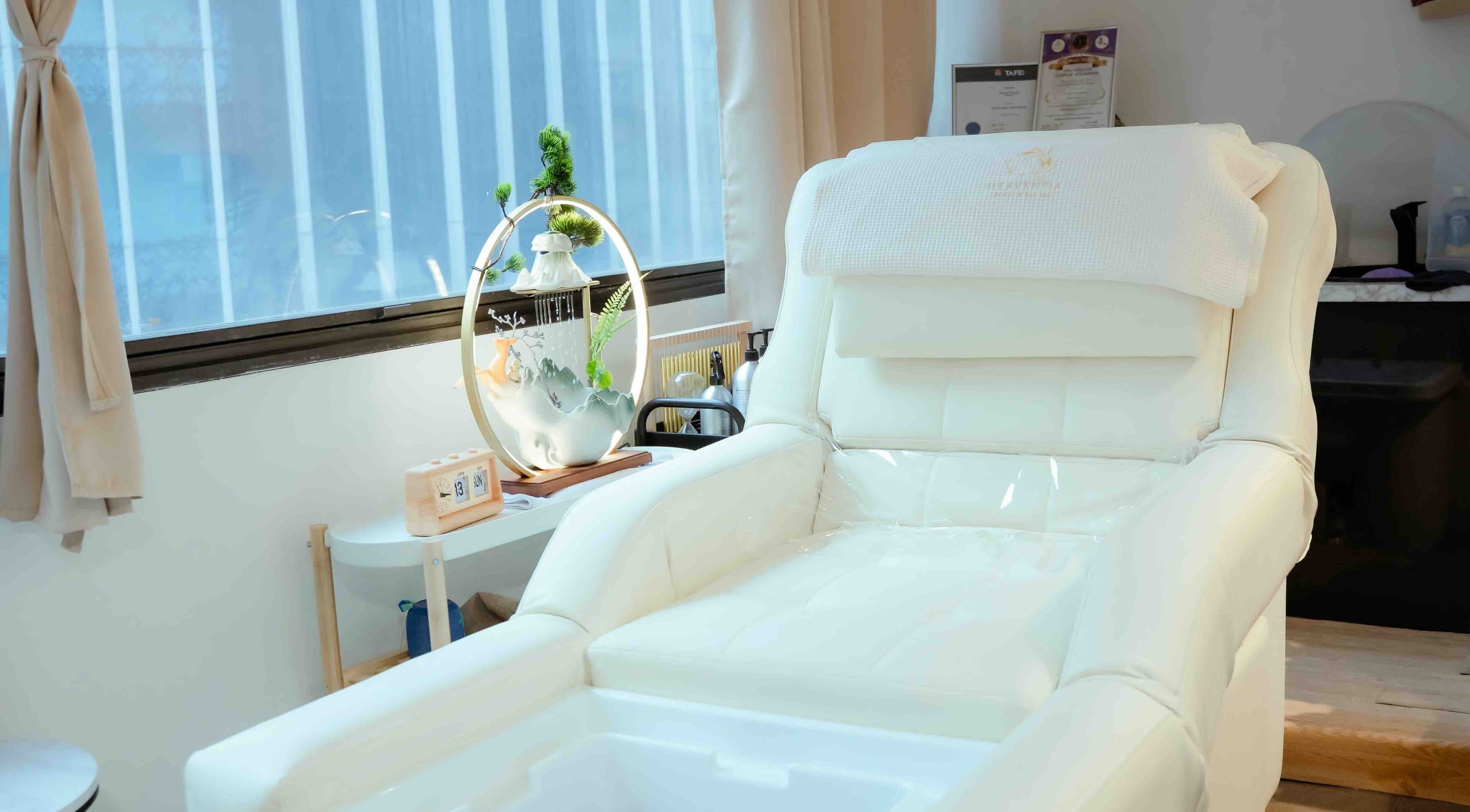 Luxurious white spa chair in Heavenna, Sydney, New South Wales, AU, bathed in natural light.