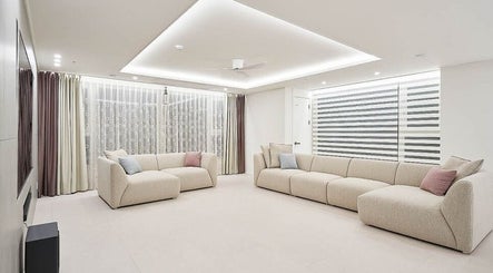 Elegant lounge area at aribeauty, Melbourne, Victoria, AU. Soft beige sofas and modern decor.