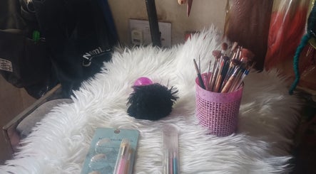 Makeup brushes and tools on white rug at NN GLOW TOUCH, Abuja, Federal Capital Territory, NG.