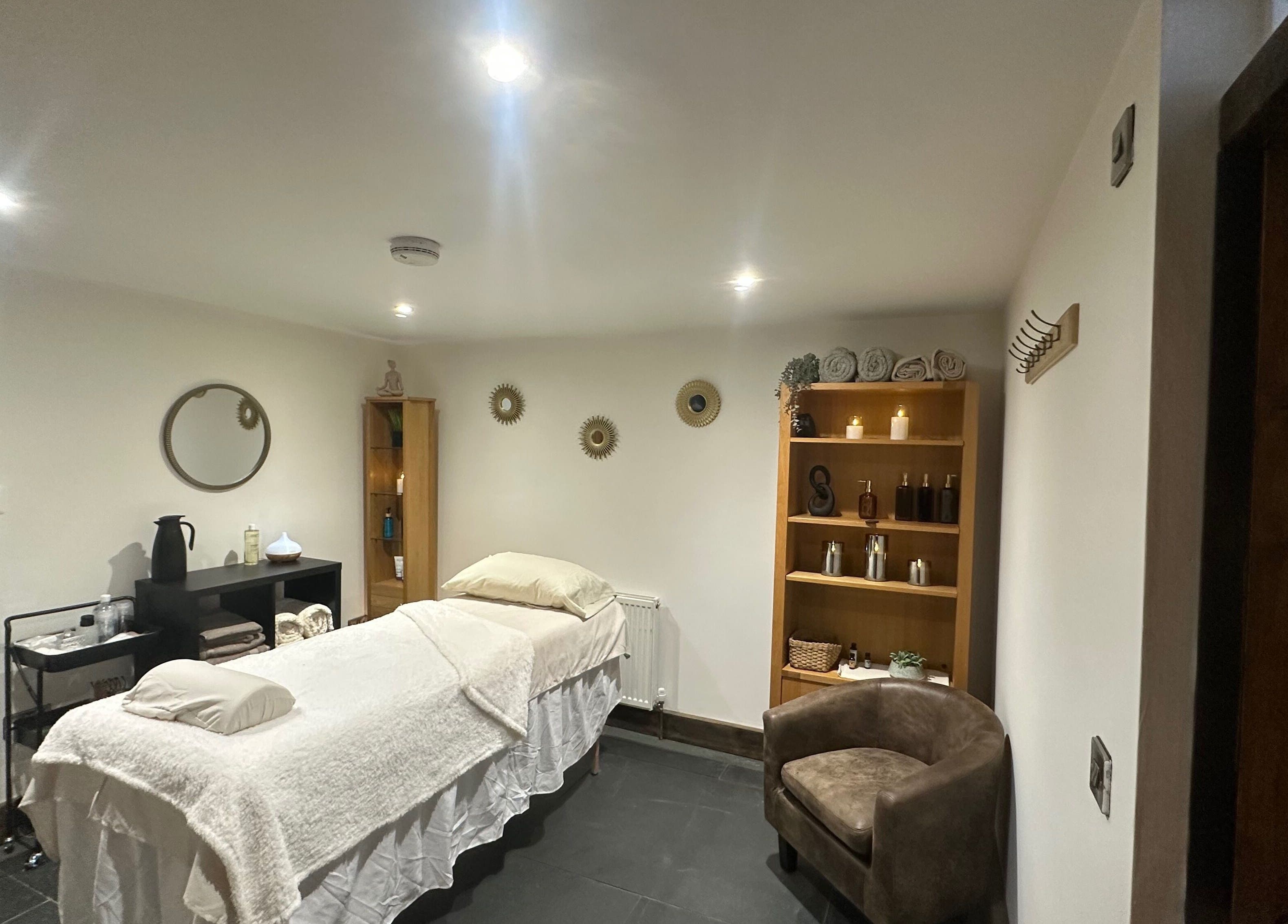 A tranquil spa room at Aylesbury health and wellness ltd, Aylesbury, England, GB, featuring a massage table.