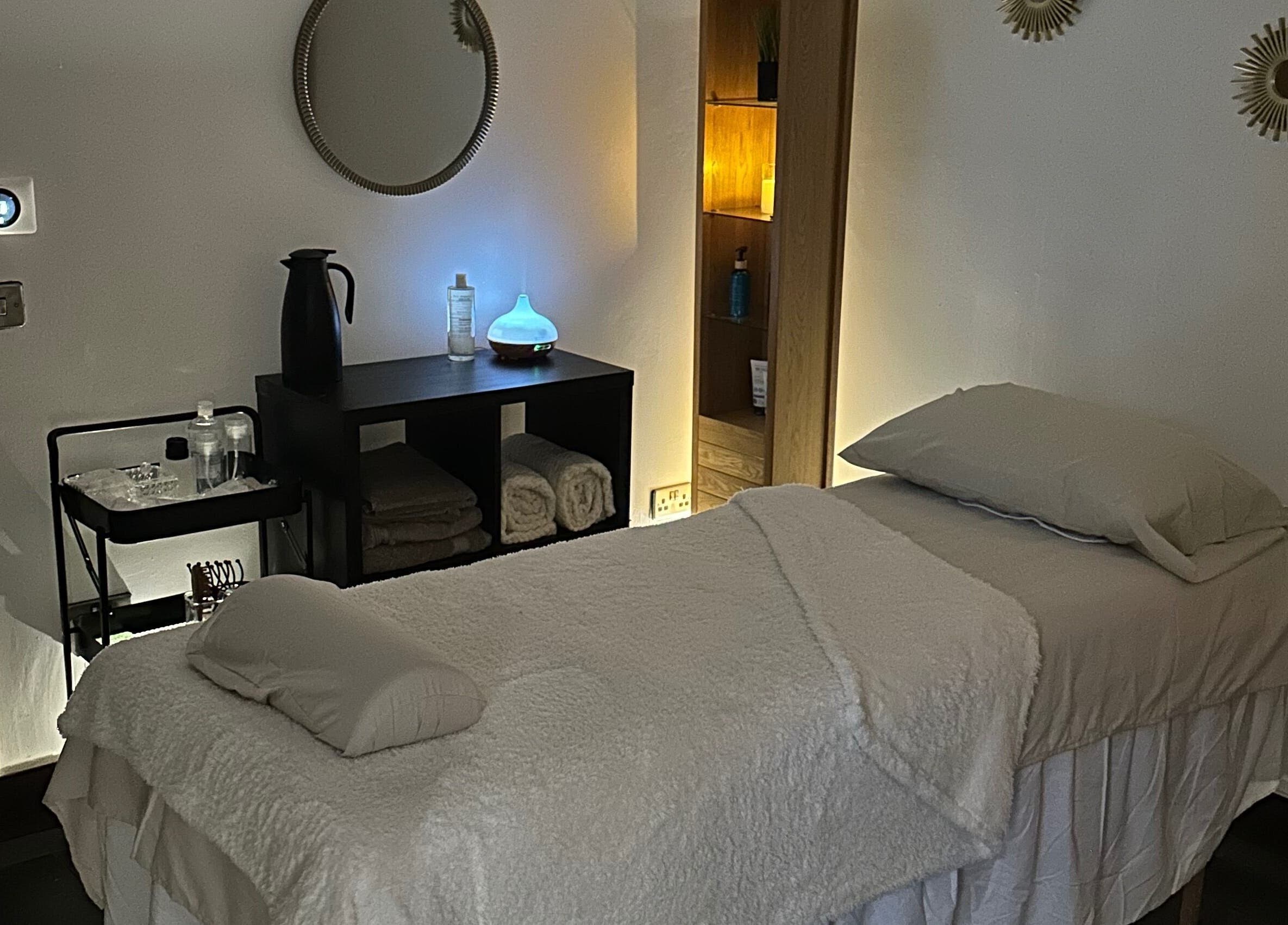 Tranquil massage room at Aylesbury health and wellness ltd, Aylesbury, England, GB, with ambient lighting.