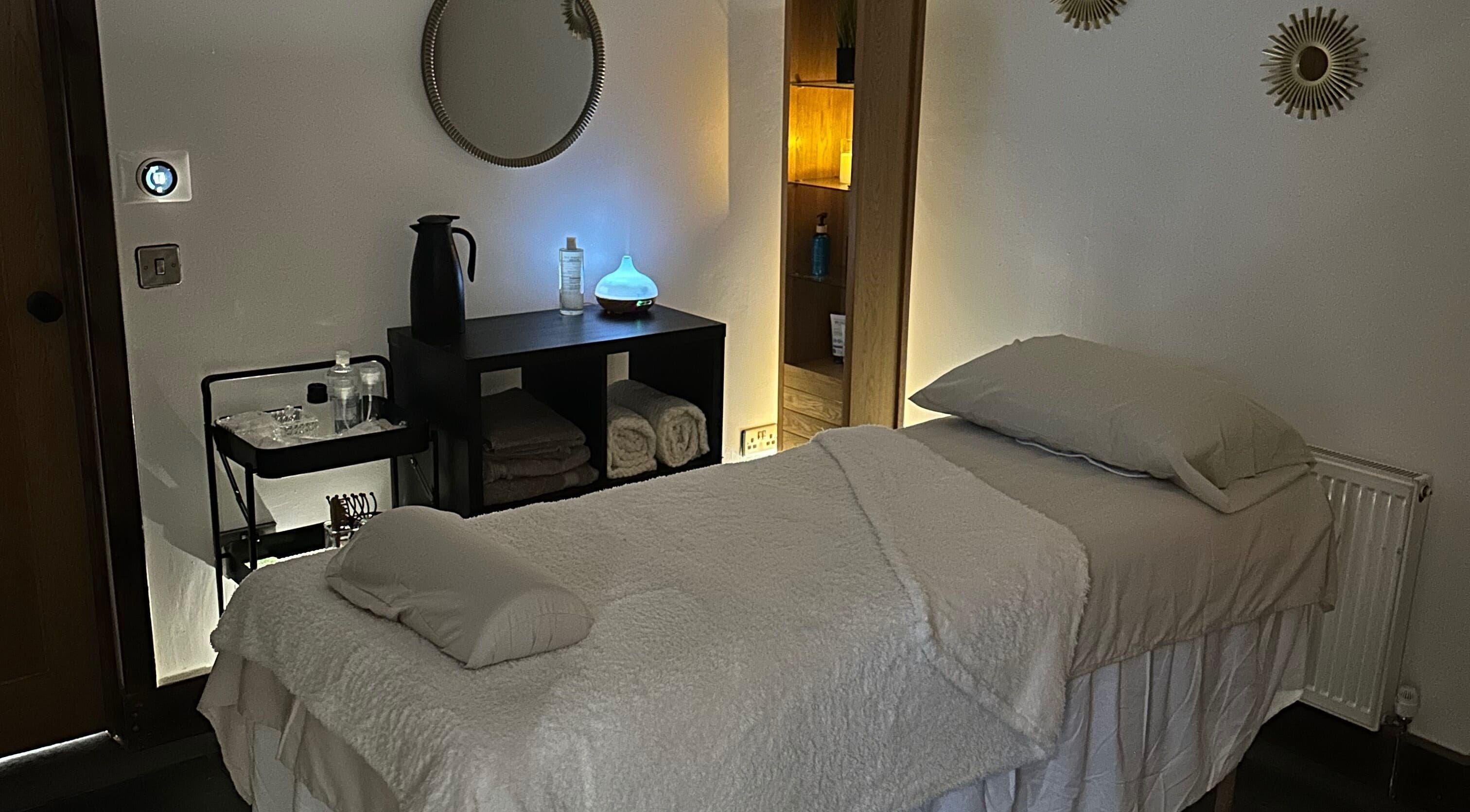 Tranquil massage room at Aylesbury health and wellness ltd, Aylesbury, England, GB, with ambient lighting.
