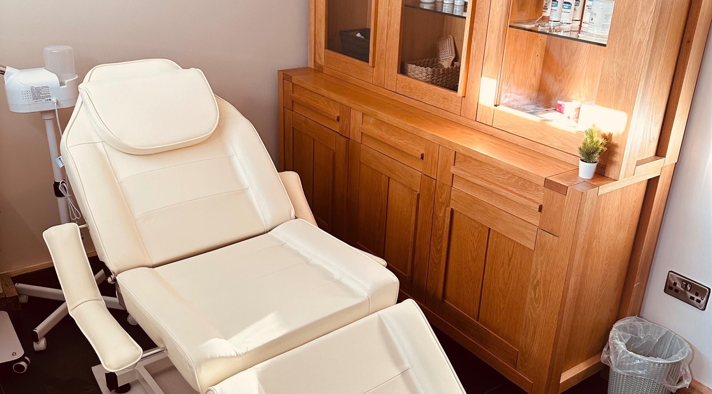 Elegant beauty room at Aylesbury health and wellness ltd in Aylesbury, England, GB with a plush treatment chair.
