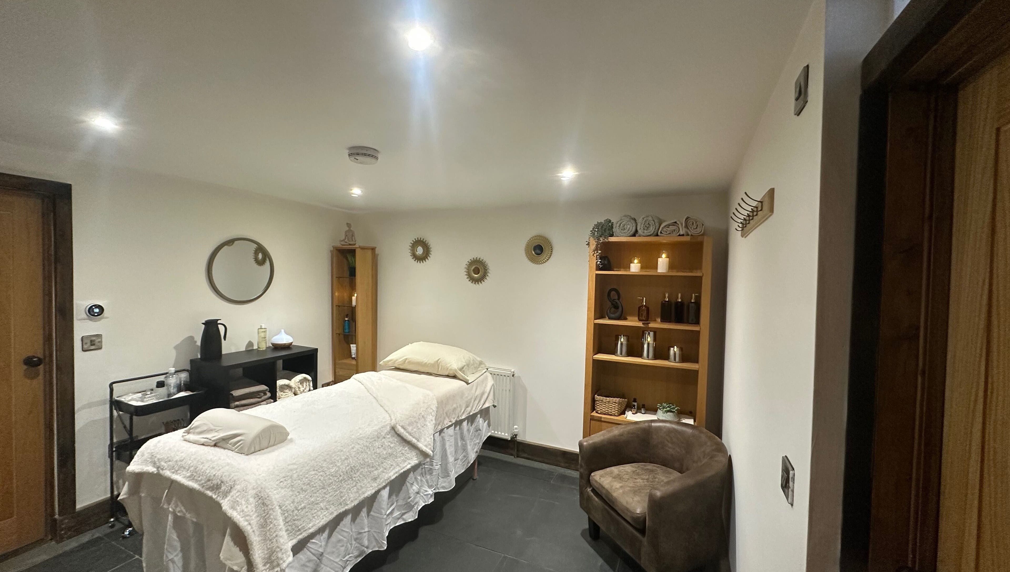 Tranquil treatment room at Aylesbury health and wellness ltd, Aylesbury, England, GB, featuring a cozy massage table.