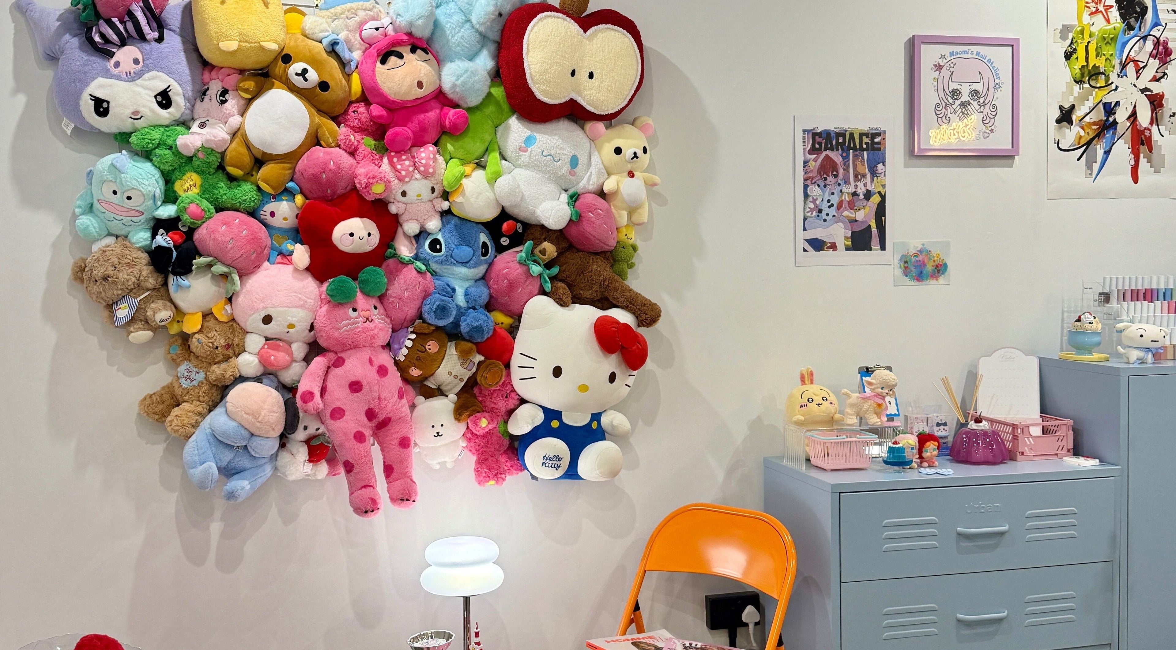 Vibrant plush toy wall at Naomi's Nail Atelier, London, England, GB, creating a cute, welcoming atmosphere.