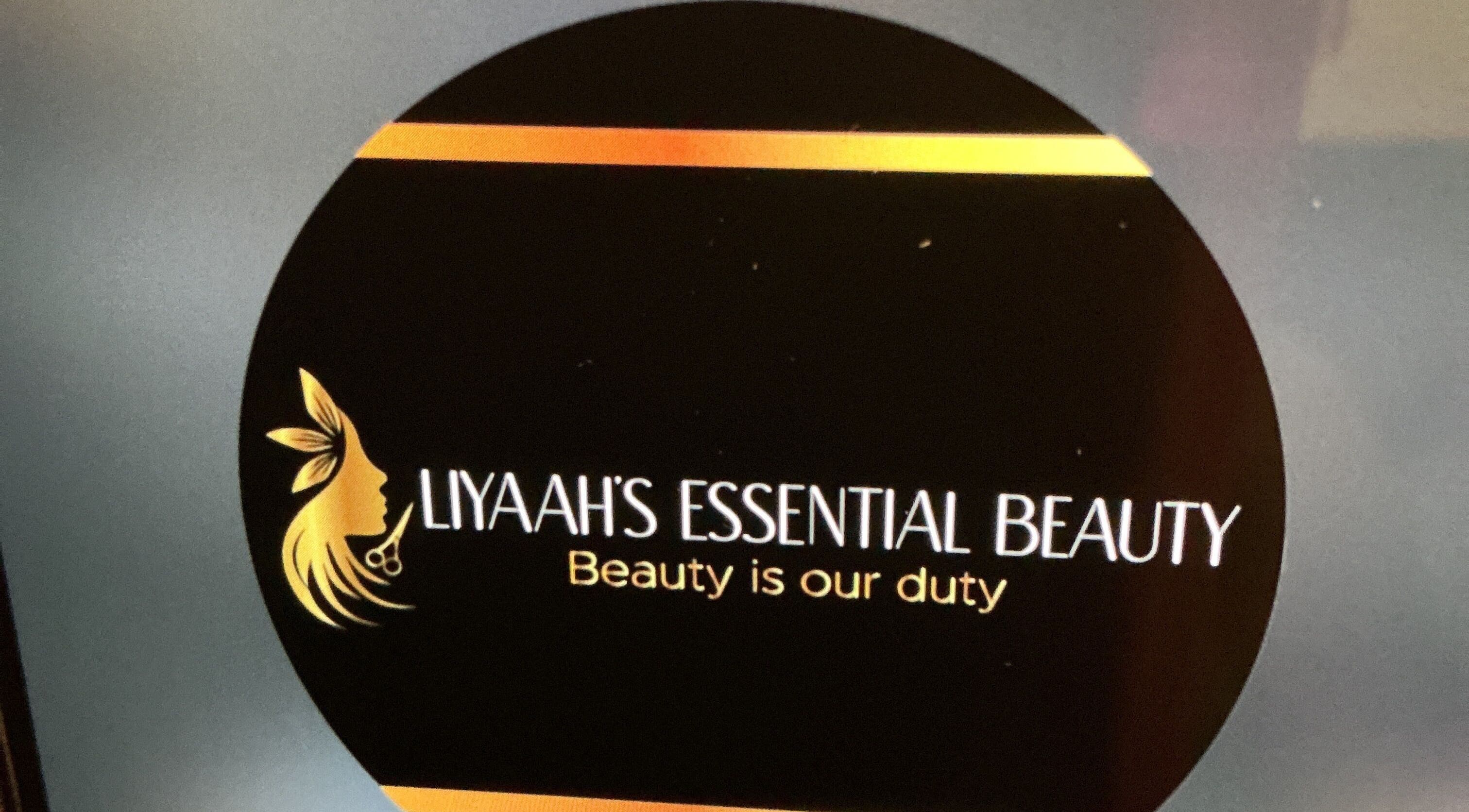 Liyaah’s Essential Beauty logo featuring a golden silhouette in Waterford, St. Catherine Parish, JM.