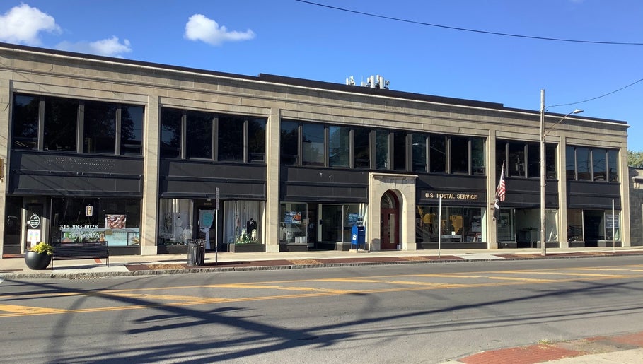 Street view of booking hair in Lahore, Punjab, PK showcasing modern architecture and inviting storefront.