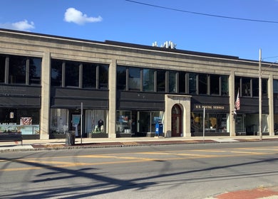 Street view of booking hair in Lahore, Punjab, PK showcasing modern architecture and inviting storefront.