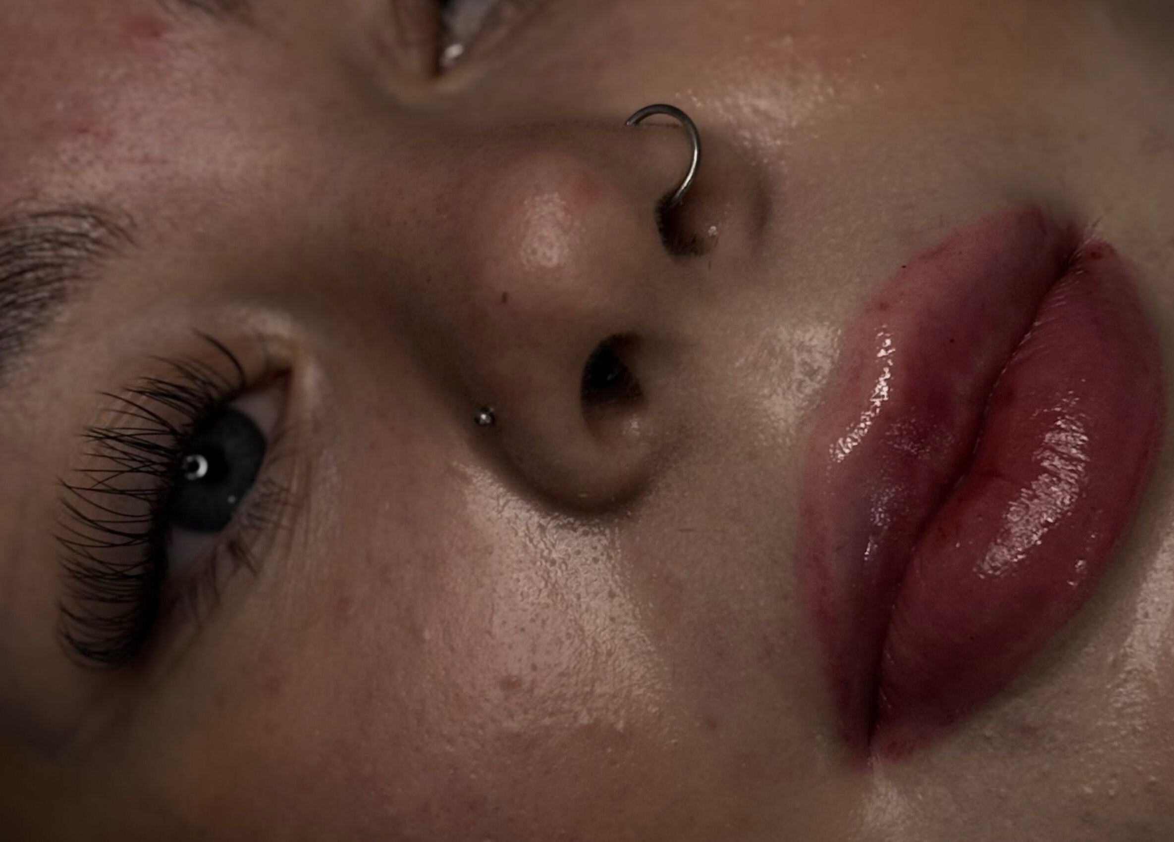 Close-up of polished lashes and lips at Luxe Lashes, Birstall, England, GB, showcasing beauty detail.