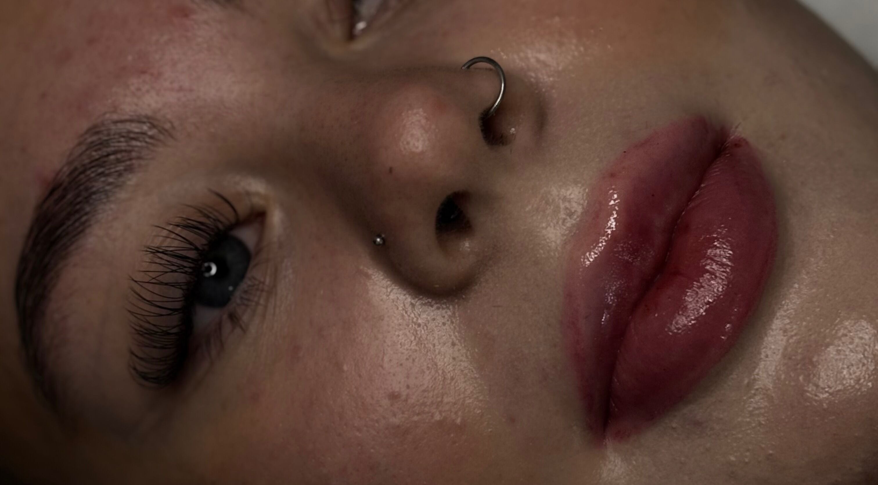 Close-up of polished lashes and lips at Luxe Lashes, Birstall, England, GB, showcasing beauty detail.