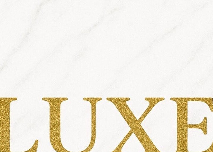 Elegant Luxe Lashes logo with gold lettering on a white marble background in Birstall, England, GB.