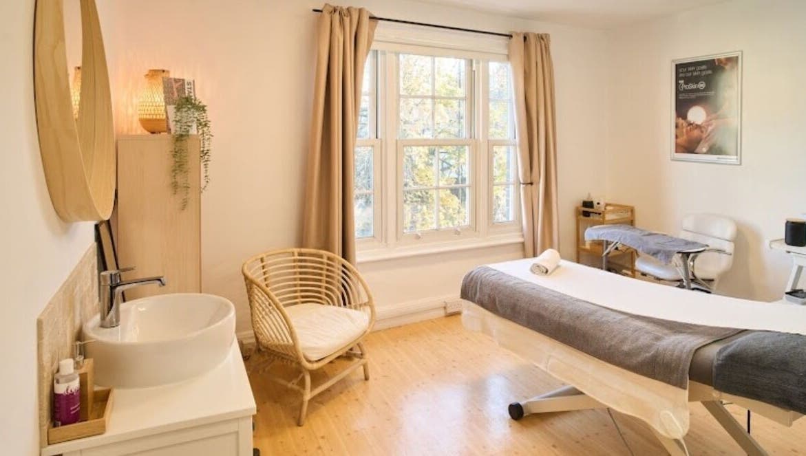 Relaxing therapy room at enhancedbychlo, Oxford, England, GB. Cozy decor and natural light create a tranquil setting.