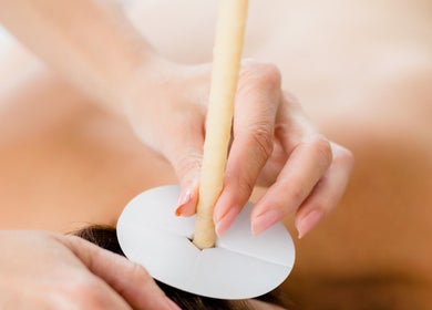 Ear candling session at Zone Therapy, Dromara, Northern Ireland, GB. A relaxing wellness treatment.