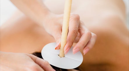 Ear candling session at Zone Therapy, Dromara, Northern Ireland, GB. A relaxing wellness treatment.