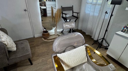 Elegant makeup studio interior at Carolayn Vega Makeup Studio in Willemstad, CW, showcasing a chic chair and decor.