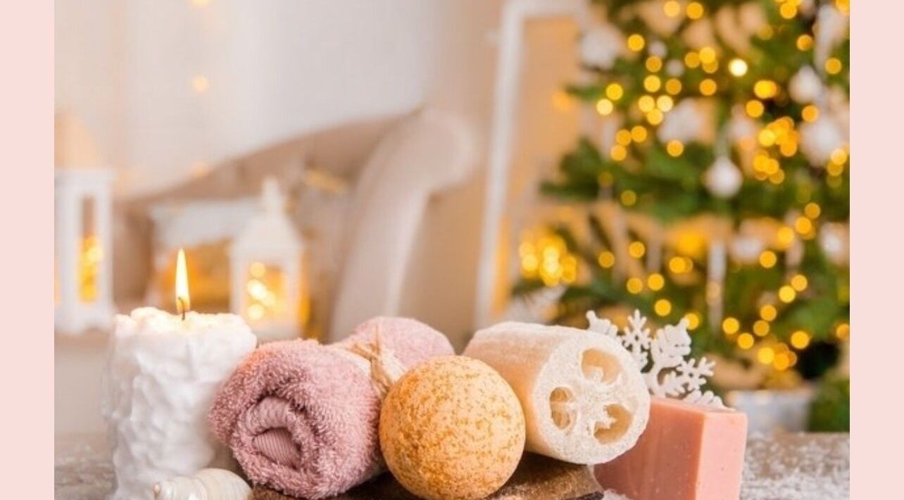 Relaxing spa setting at Somar Wellness Spa in Grapevine, Texas, US, with candles, towels, and Christmas decor.
