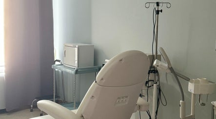 Modern treatment room at Northshore Health and Beauty, Skokie, Illinois, US, featuring a comfortable chair and equipment.