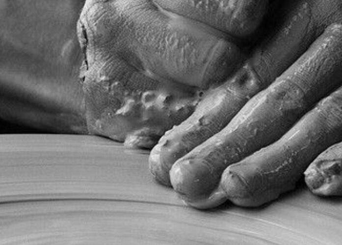 Close-up of hands crafting clay at The Aesthetic House, London, England, GB.