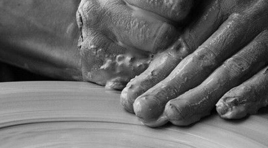 Close-up of hands crafting clay at The Aesthetic House, London, England, GB.