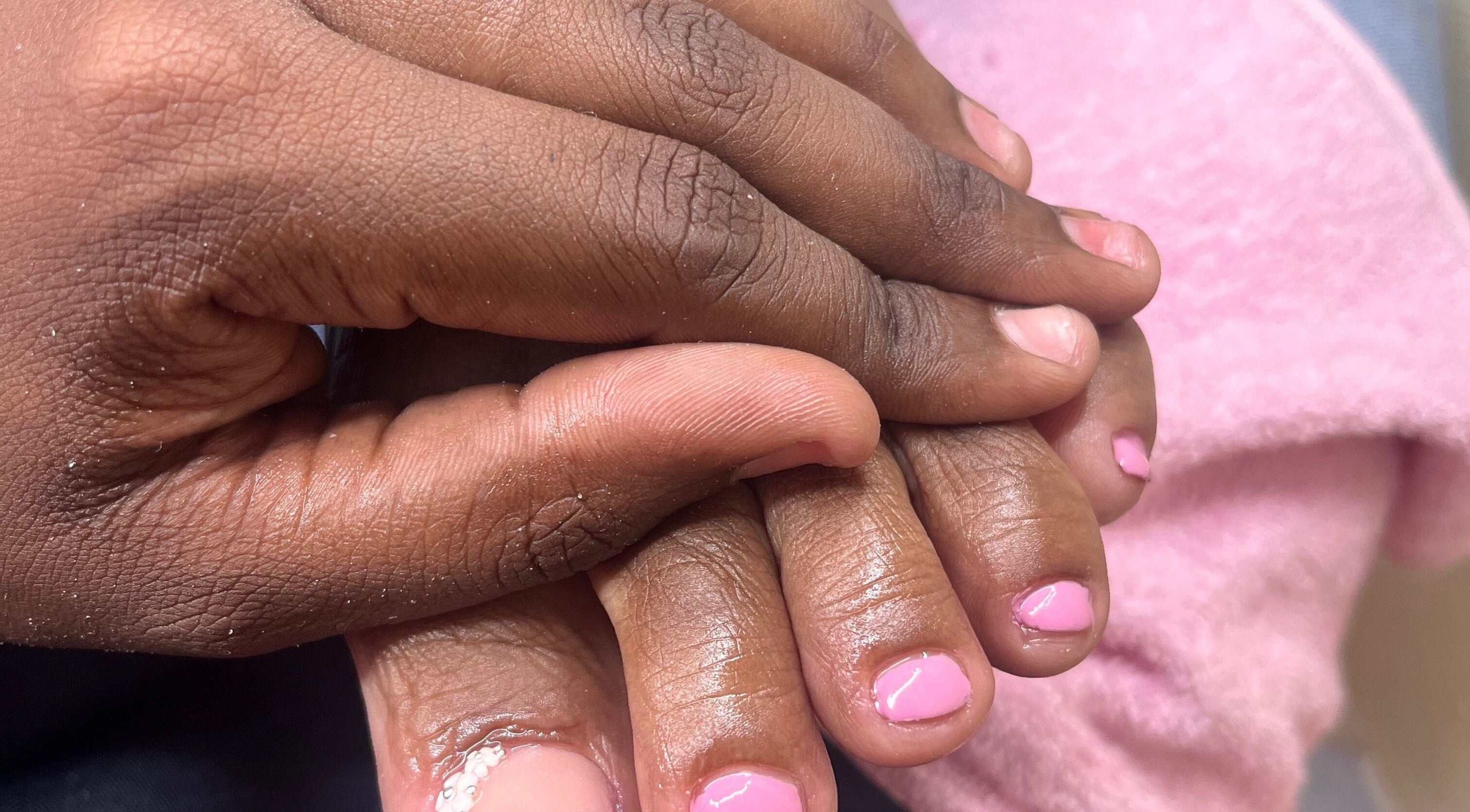 Close-up of hands with pink manicure at Keta’s Nailz, Bridgetown, Saint James, BB.
