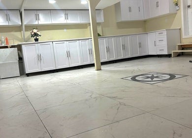 Sunlit modern interior of ZARA BEAUTE YUL, Mirabel, Québec, CA featuring sleek white cabinetry.