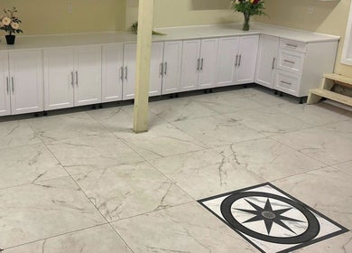 Elegant marble flooring and white cabinetry at ZARA BEAUTE YUL in Mirabel, Québec, CA, enhancing relaxation.