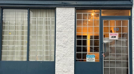 Front entrance of Pemf Healing Waves at Coquitlam, British Columbia, CA, showcasing modern design.