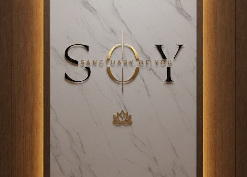 Entrance sign for Sanctuary Of You in San Juan, San Juan, PR featuring gold accents on a marble background.