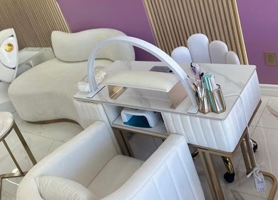 Elegant manicure station at Urban Beauty, Tijuana, Baja California, MX, featuring plush seating and modern decor.