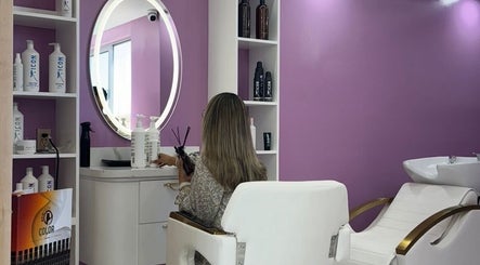 Urban Beauty salon interior in Tijuana, Baja California, MX with a stylish purple wall and chic decor.