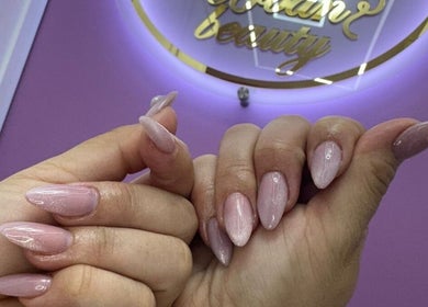 Elegant nude manicure at Urban Beauty in Tijuana, Baja California, MX, showcasing luxurious nail care.