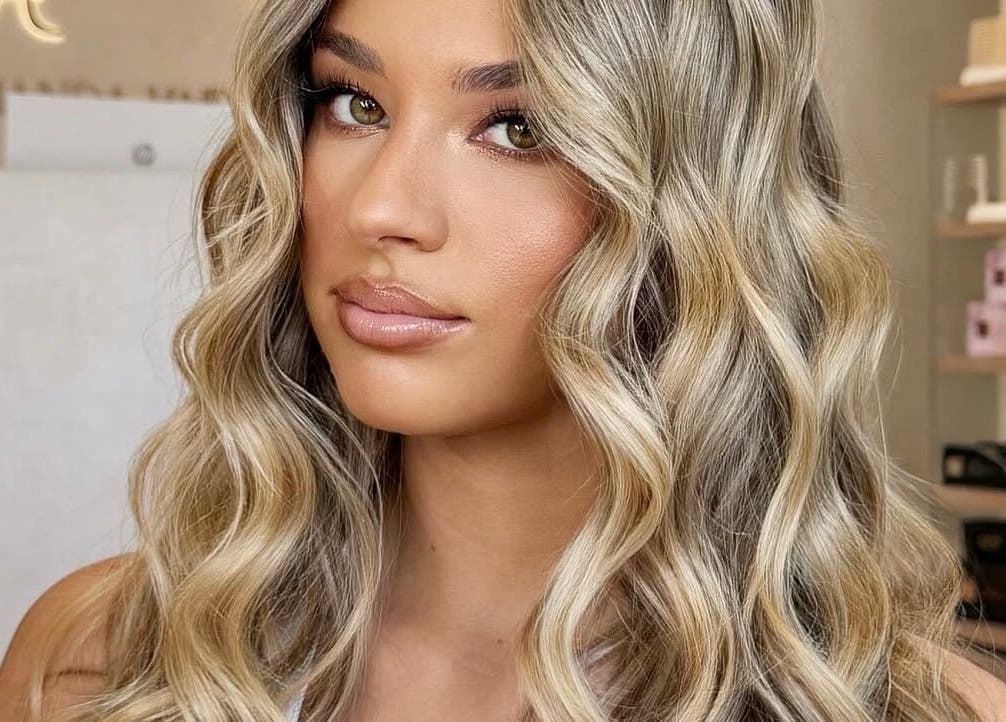 Woman with wavy blonde hair styled elegantly at By Brooke Lee, Perth, Western Australia, AU.