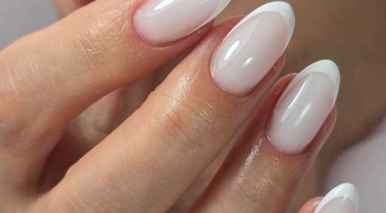 Stylish French manicure at Bougie Maison, Dublin 15, County Dublin, IE, showcasing glossy white-tipped nails.