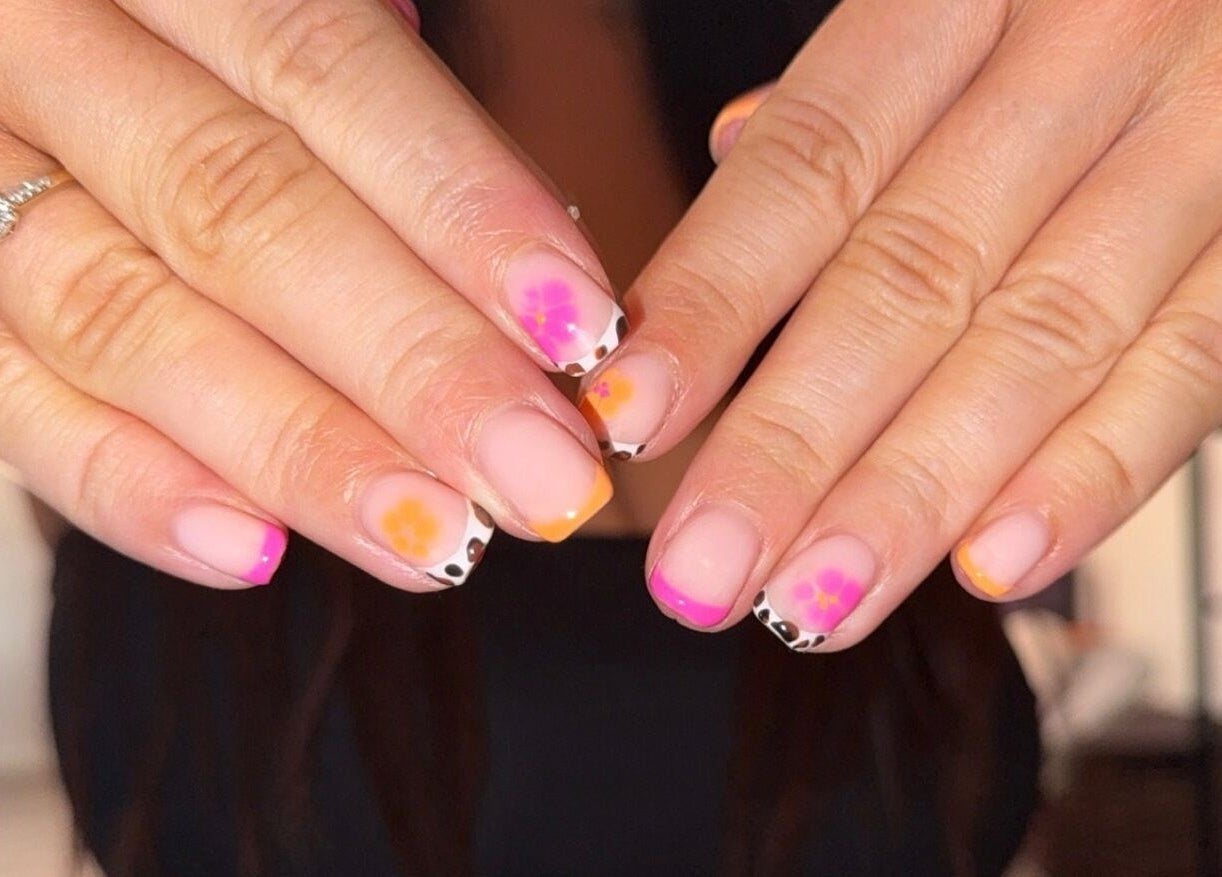 Elegant floral nail art by Beauty by Mel in Glenfield, England, GB showcases intricate designs and vibrant colors.