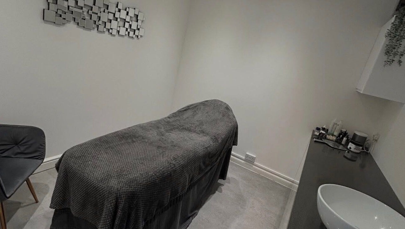 Relaxing treatment room at Beauty by Mel, Glenfield, England, GB featuring a comfortable massage bed and modern decor.