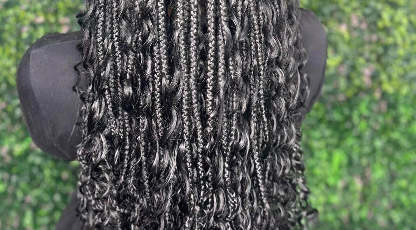 Intricate braids at Estherozy, Camillo, Western Australia, AU, showcasing expert styling in natural setting.