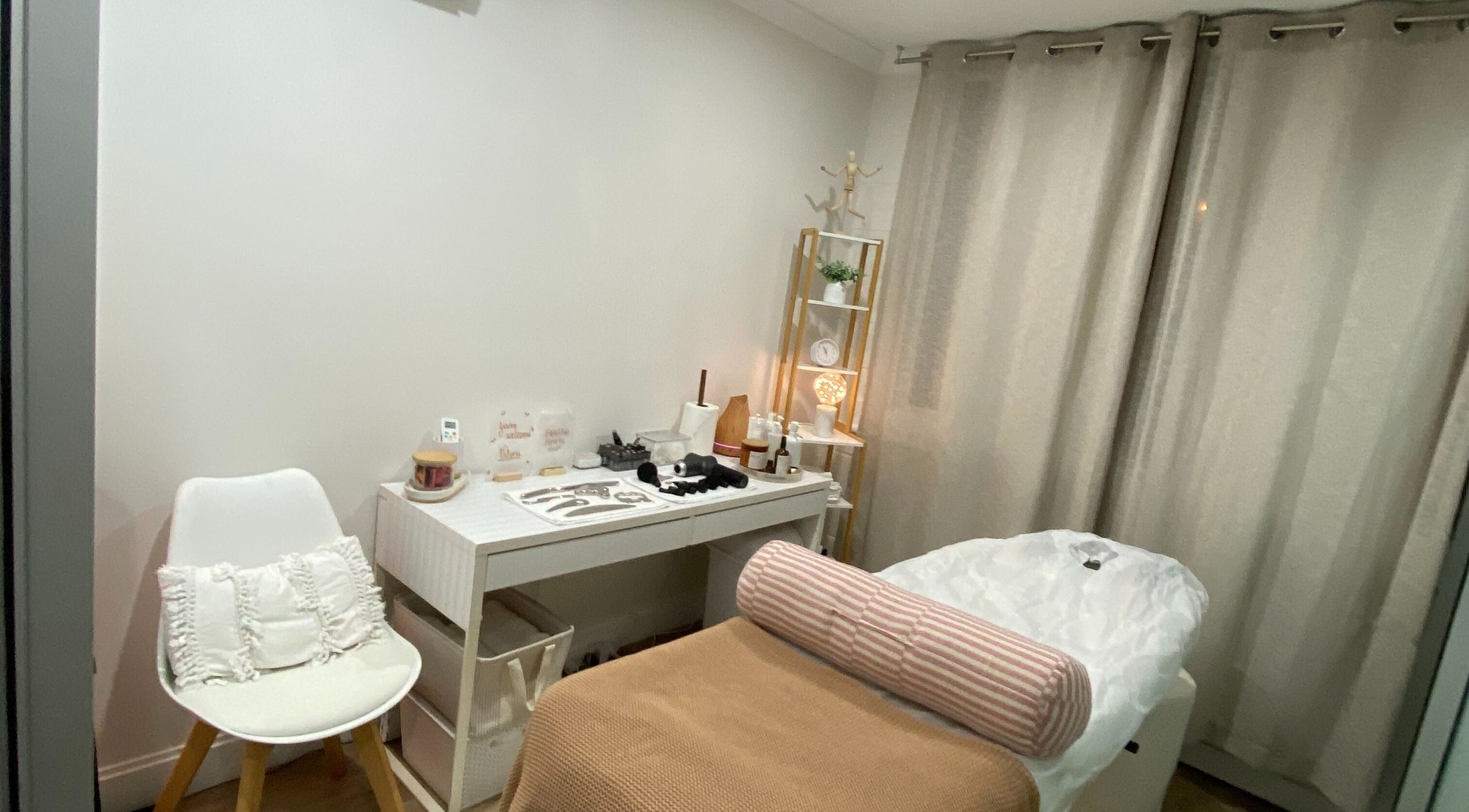 Relaxing therapy room at Anavi - Health and Care, Surfers Paradise, Queensland, AU, featuring a massage table and cozy decor.