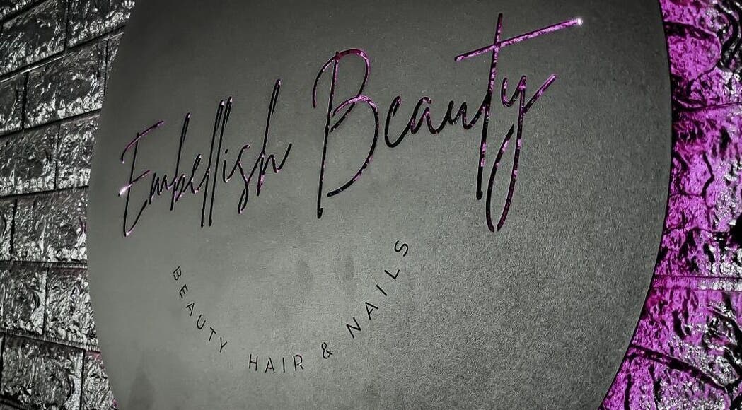 Embellish Beauty Salon's elegant logo sign in Germiston, Gauteng, ZA with purple accents.