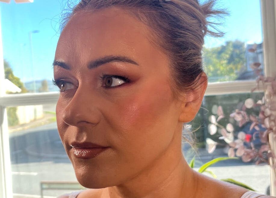 Close-up of radiant makeup by Makeup By Naomi Jane at Ystrad Mynach, Wales, GB in natural light.
