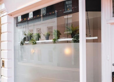 Front view of Nics Nails in Shrewsbury, England, GB showcasing elegant window decor and modern exterior.