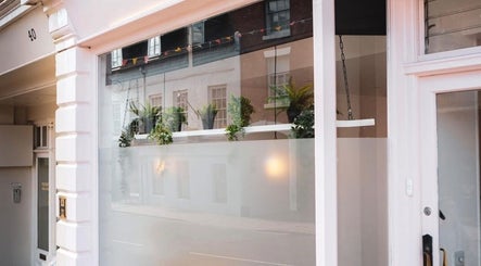 Front view of Nics Nails in Shrewsbury, England, GB showcasing elegant window decor and modern exterior.