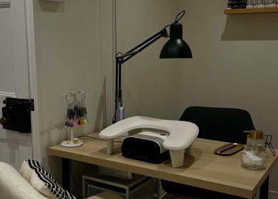 Nics Nails manicure station in Shrewsbury, England, GB, featuring nail tools and cozy decor.