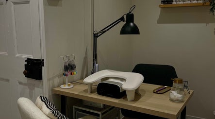 Nics Nails manicure station in Shrewsbury, England, GB, featuring nail tools and cozy decor.