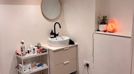 Serene beauty room at Nics Nails, Shrewsbury, England, GB with elegant sink and calming decor.