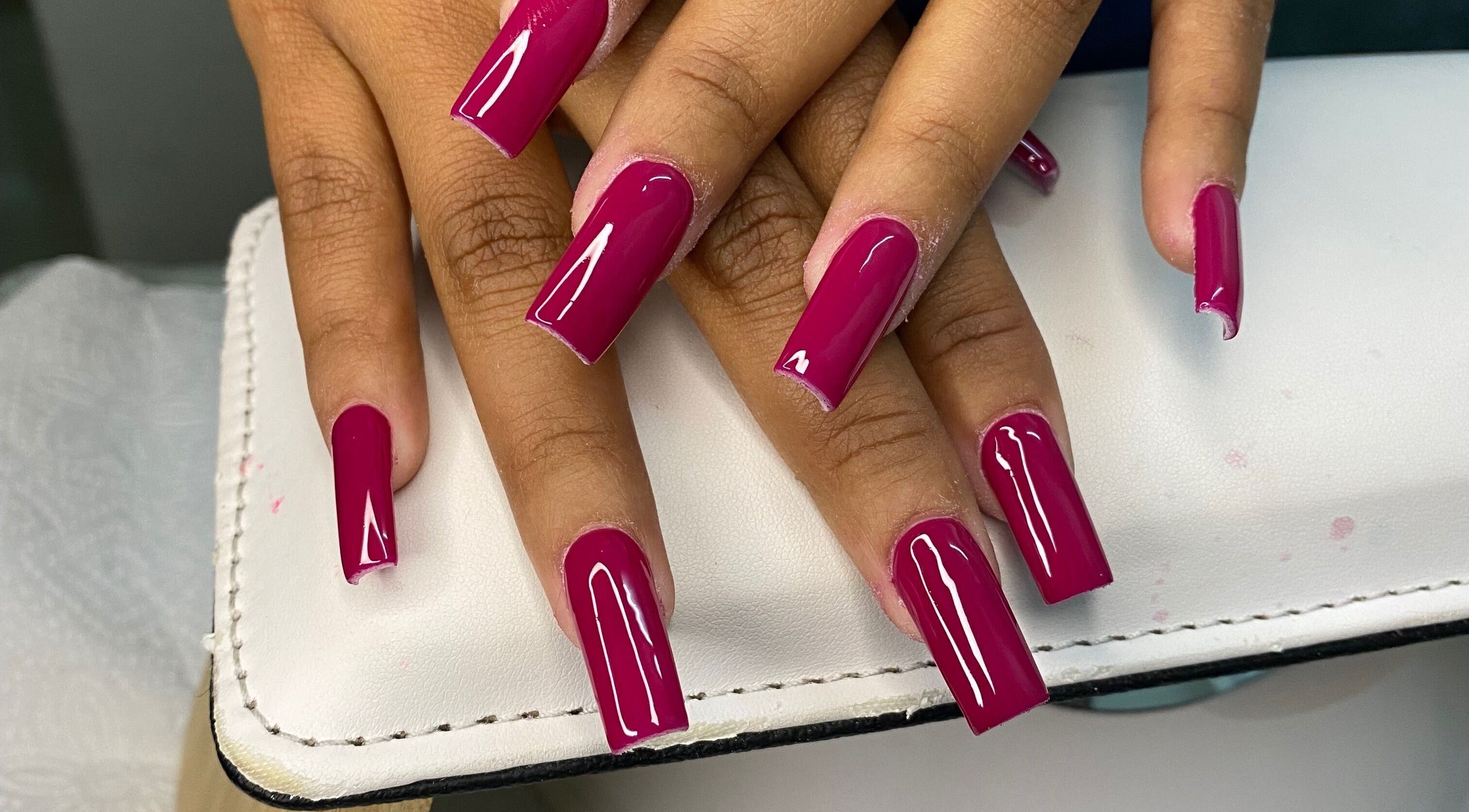 Magenta manicured nails at Nails by Fila, Durban, Kwazulu-natal, ZA, showcasing vibrant nail art.
