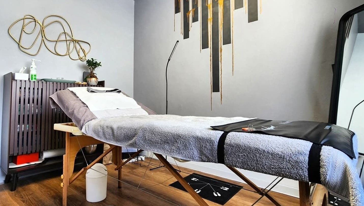 Calm therapy room at Smu_th in the city | Dr.K, Cape Town, Western Cape, ZA with a comfortable massage table.