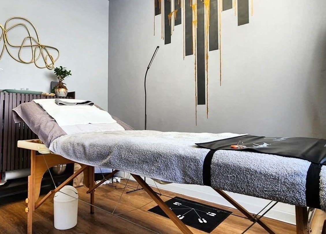 Calm therapy room at Smu_th in the city | Dr.K, Cape Town, Western Cape, ZA with a comfortable massage table.